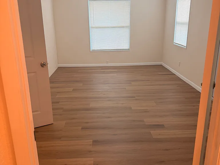 view of master bedroom from closet
