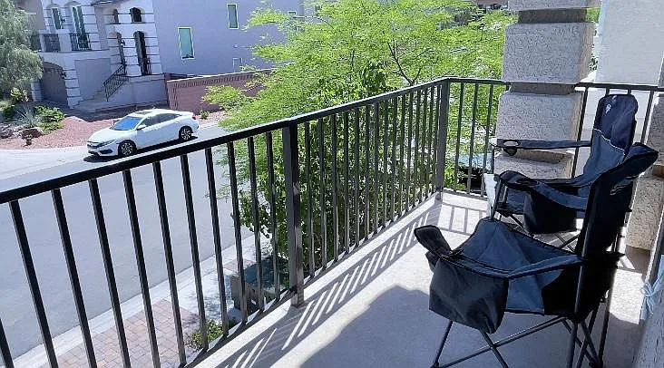 This balcony overlooks a quiet street w/ a dog park at the end of the cul-de-sac.