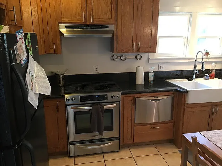 Kitchen with a big sink, dishwasher (new), stove, oven, and refrigerator