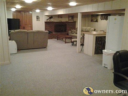 alternate view of basement with fireplace