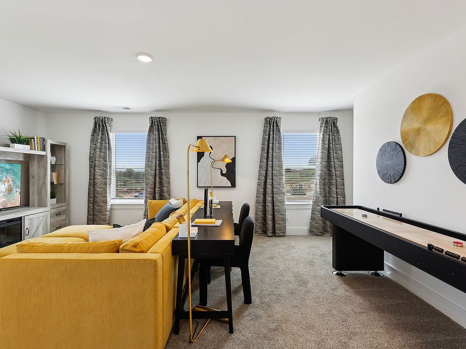 The bonus room offers a place for the kids to work on homework.