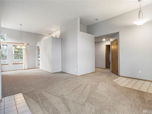 Entering through the front entrance you are in the great room area with living room and formal dining room. 