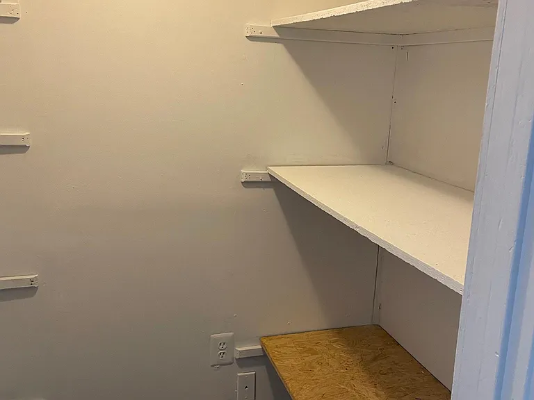 Storage room in Basement with shelfs