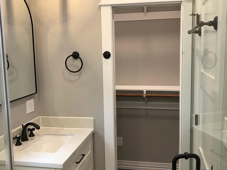 Private custom bathroom with entry to walk in closet