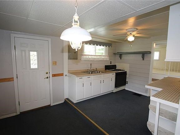 Spacious 15x10 Eat-in Kitchen w/ Dining area, plenty of cabinets & double bowl stainless steel sink. Newer Front Door w/ Lead Gl