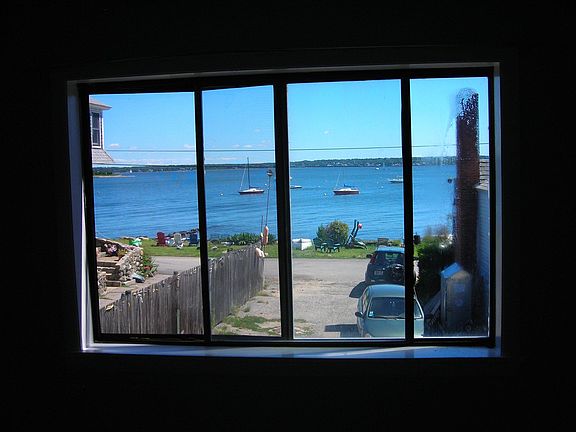 water view from living room. Neighborhood beach across the street.