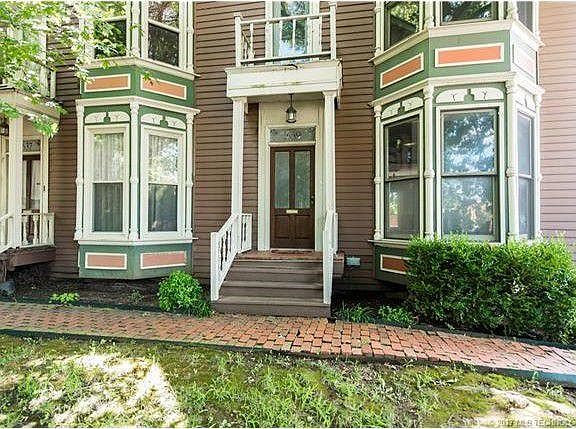 Front door and Bay Windows! guest parking beside this end un