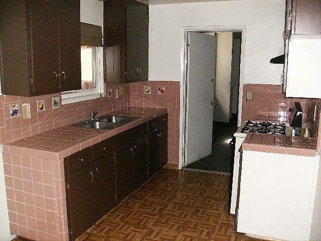 kitchen next to dining area which is open to living room