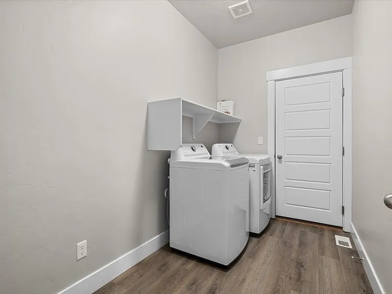 Laundry room with washer and dryer