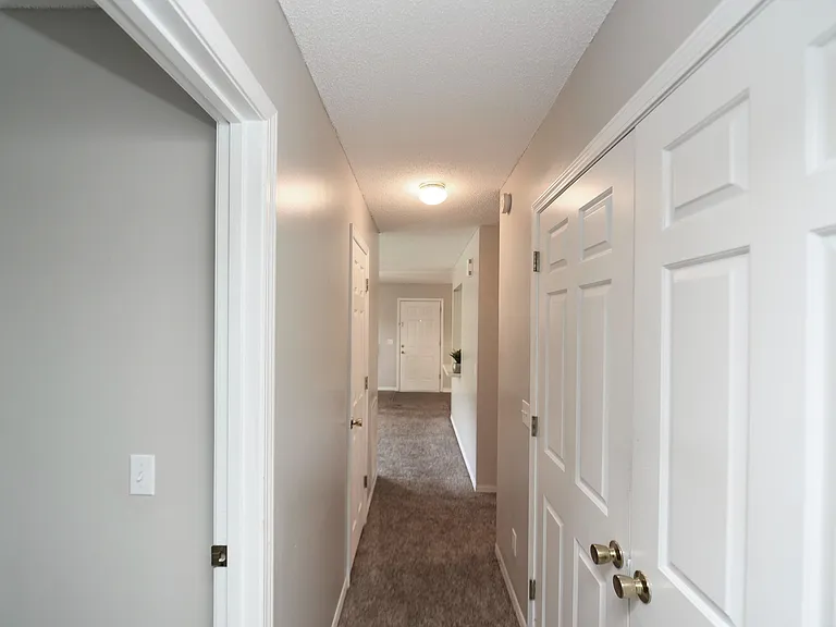 Hallway with carpet