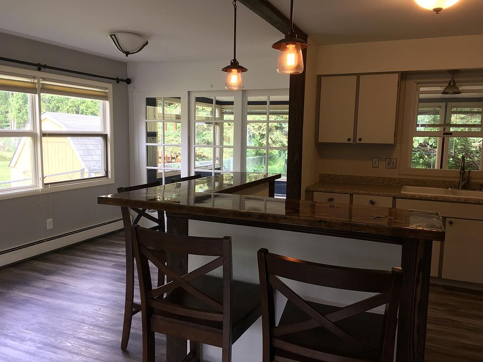 Kitchen area looking out so sun room