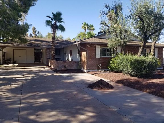 2 car carport with large storage shed