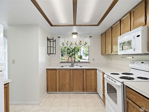 The kitchen is easy to work in & features generous cabinet space. All appliances are included in the sale. 