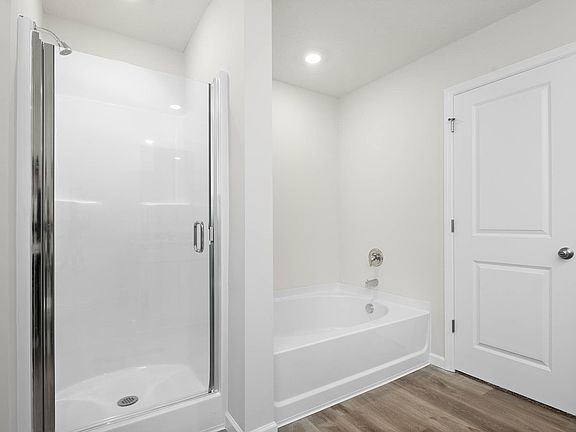 The master bathroom also has step in shower and soaking tub.