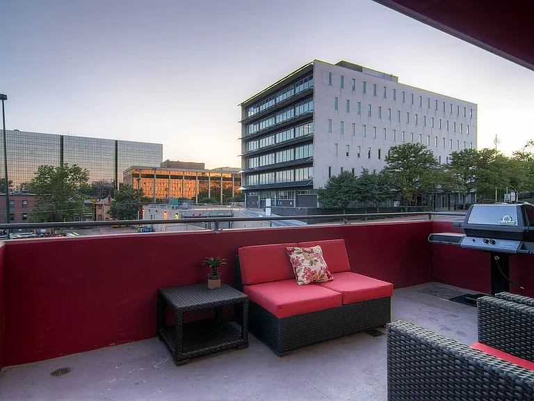 Our Apartment Common Area Patio with BBQ Grill at Sleek Lofts Apartments in Denver, Colorado