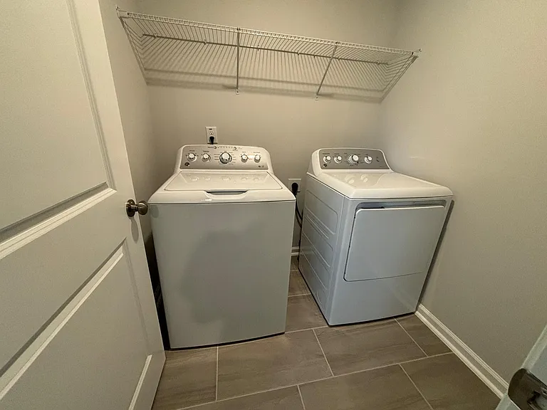 Laundry room with brand new Washer and Dryer