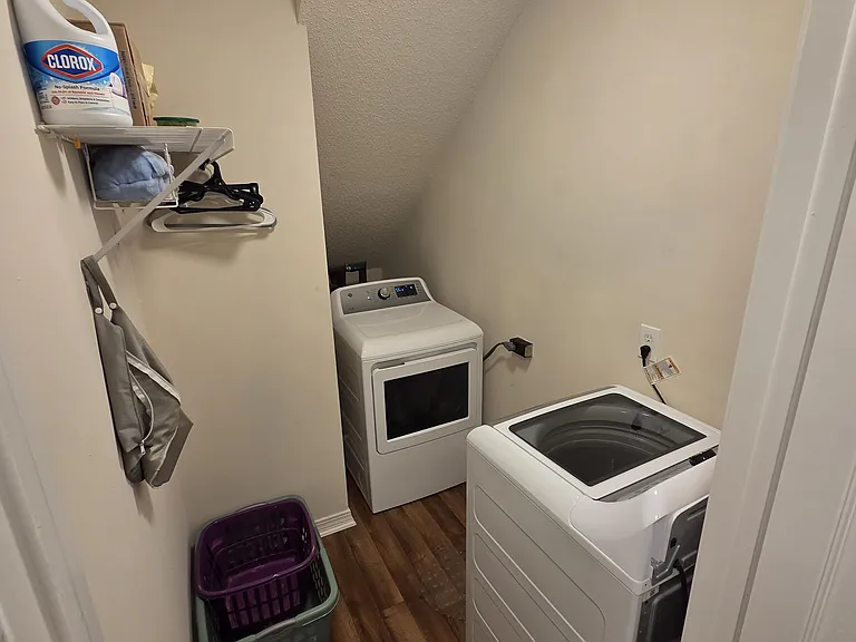 Laundry room. Water heater behind dryer.
