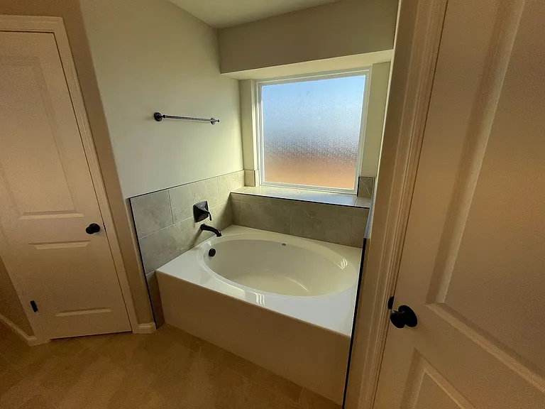 Master Bathroom with bathtub and standing shower