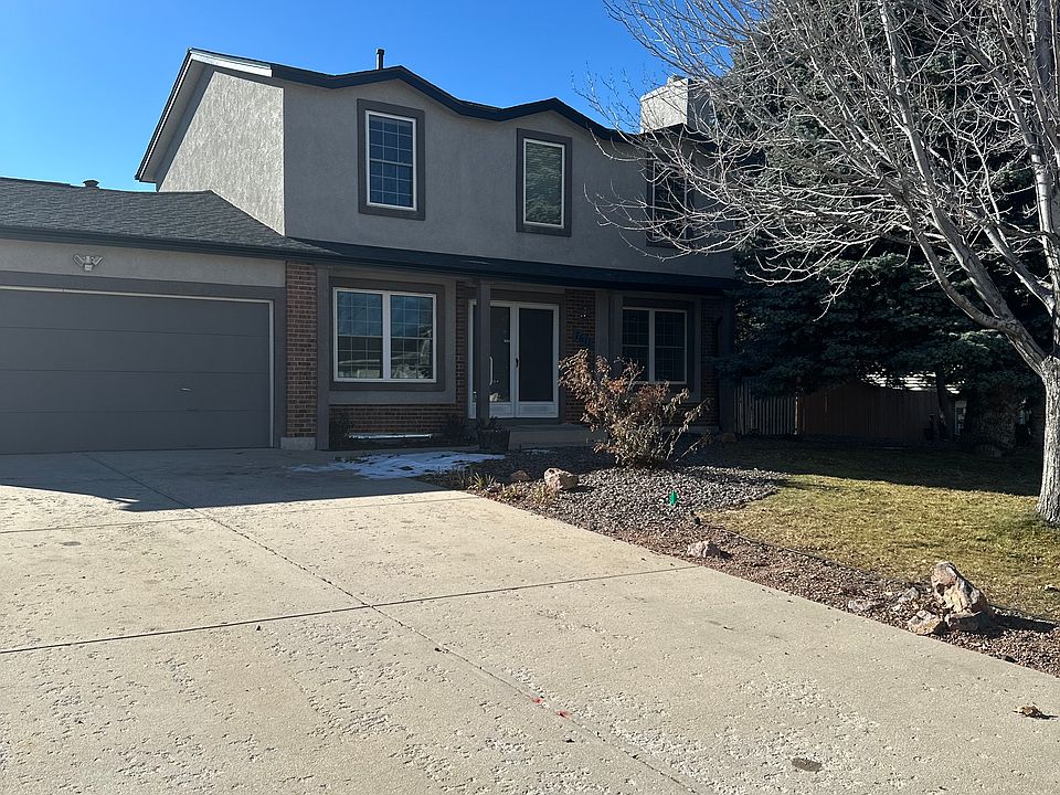 Front of home with attached garage, large lot is a bonus.