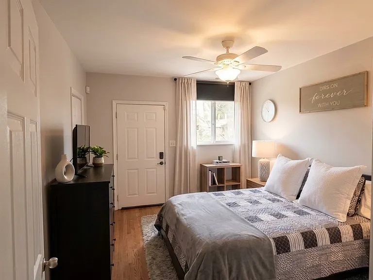 Primary with custom-built walk-in closet and en suite bathroom