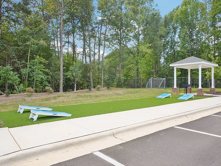 Cornhole and outdoor activity area at Emerson Point Apartments in Elon, NC