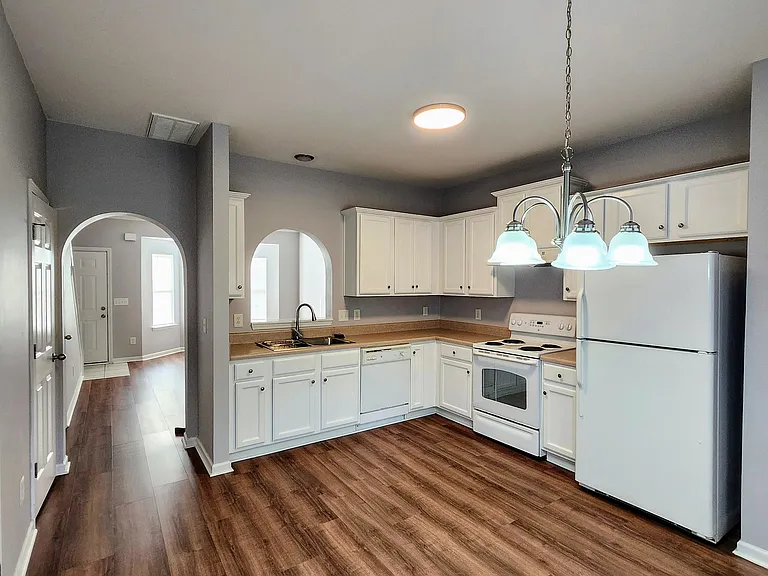 Kitchen with view into living room