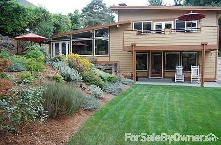 Great Room space on Main
						:
						Wall of windows view private garden space, patio area, and large back yard.