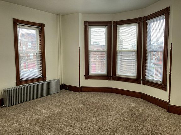 Spacious living room with bay windows