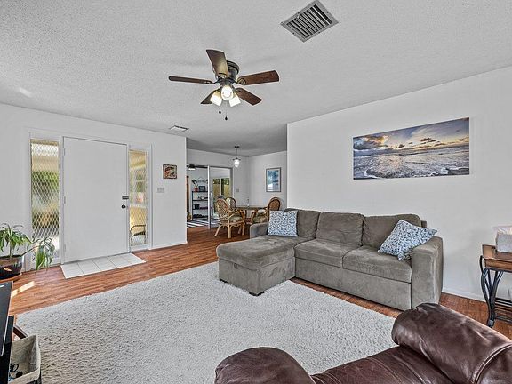The living room is large and filled with lots of natural light.