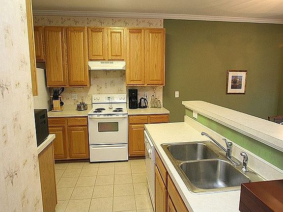 Kitchen Has 42 Inch Custom Oak Cabinets & Ceramic Tile Floor