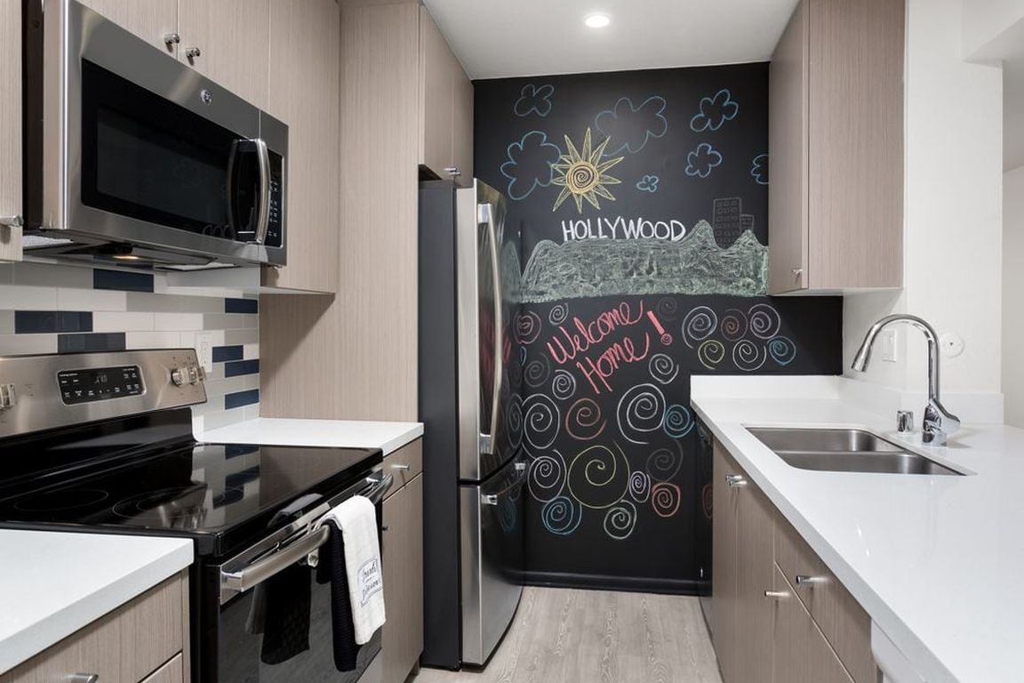 Design Package III Kitchen with hard surface flooring stainless steel appliances