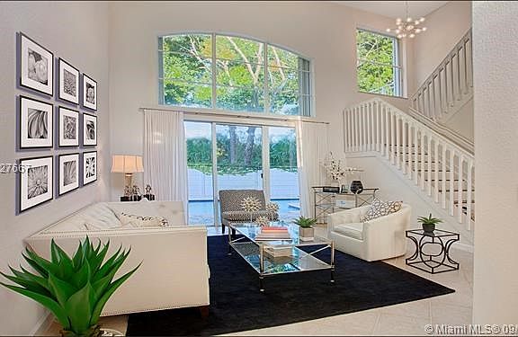 Living room with high ceilings and plenty of natural lighting