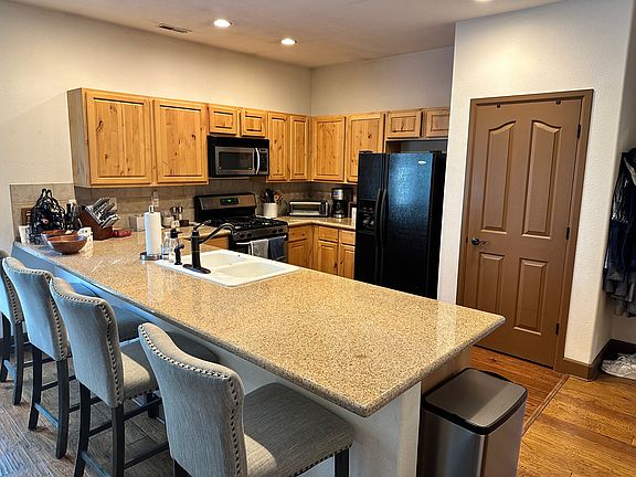 Kitchen with eating bar, granite counters