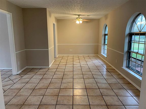 FORMAL DINING ROOM AND FORMAL LIVING ROOM/STUDY... THE LIVING ROOM/STUDY IS OPEN TO THE FAMILY ROOM. FRESH NEUTRAL PAINT IS THROUGHOUT THE HOME.