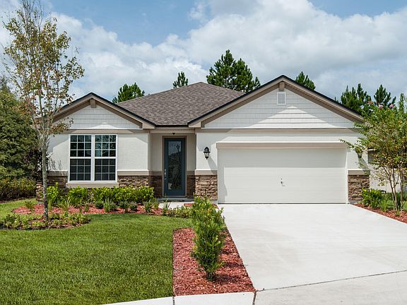 stucco and stone ranch with two-car garage