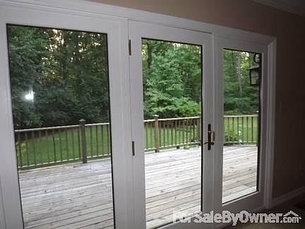 Inside View of Back Deck From Livingroom
						:
						View of back deck with beautiful trees, advanced landscaping, lots of wildlife.