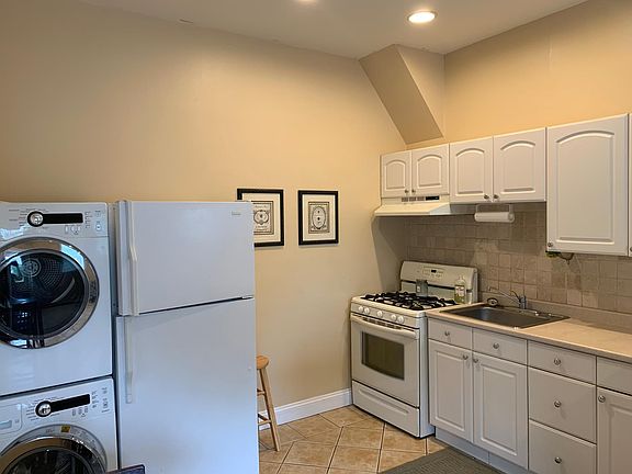 Kitchen with gas range and washer/dryer