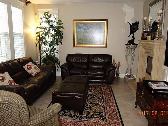 FR with built-in entertainment center & a stone fireplace