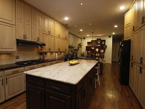 Kitchen has 10' floor to ceiling millwork. Large island, and large breakfast area.