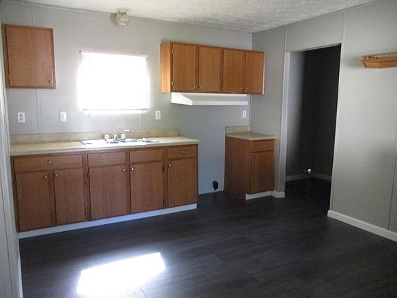 Kitchen area also the back room is the laundry room area