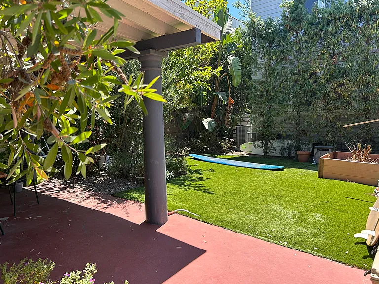 Backyard with turf lawn