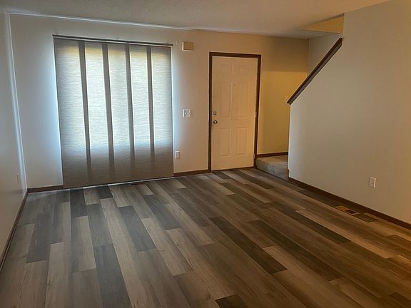 Living Room luxury vinyl tile and slider window covering