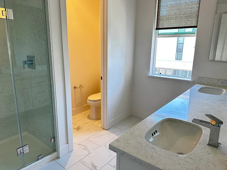 Third Floor - Master Bath with dual sinks and a shower.