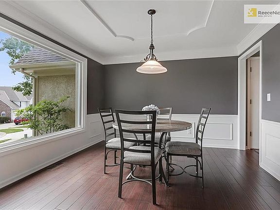FORMAL DINING ROOM WITH NEW BAMBOO FLOORS, LARGE WINDOW AND TODAYS COLORS
