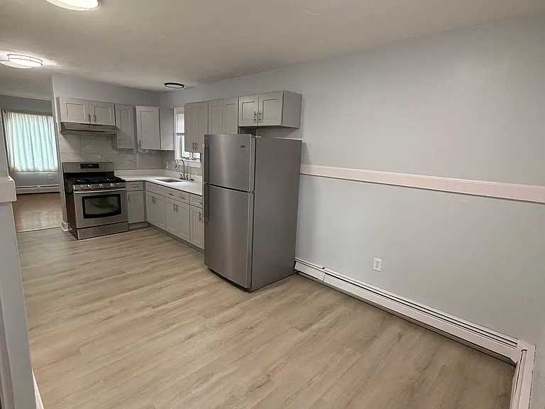 View from the back door, looking into the kitchen.