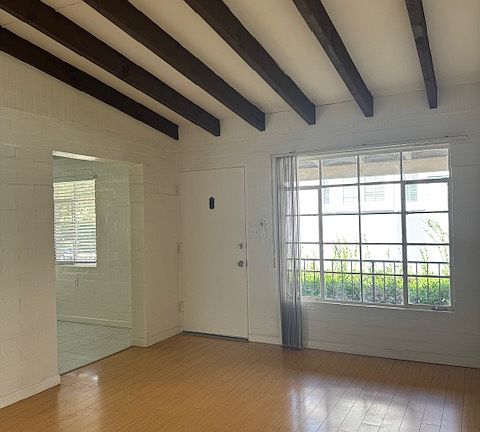 BEAMED, VAULTED CEILING IN LIVING ROOM WITHLOTS OF NATURAL LIGHT - LARGE PICTURE WINDOW