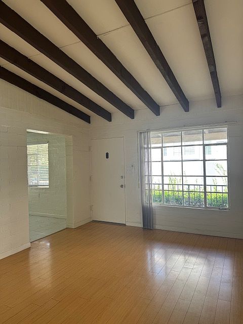BEAMED, VAULTED CEILING IN LIVING ROOM WITHLOTS OF NATURAL LIGHT - LARGE PICTURE WINDOW