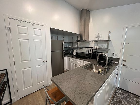 Kitchen area with walk-in pantry