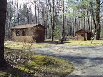 The heated work shop and garden shed.