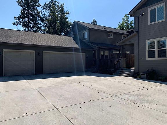 Garage and driveway. Entry to right of garage.